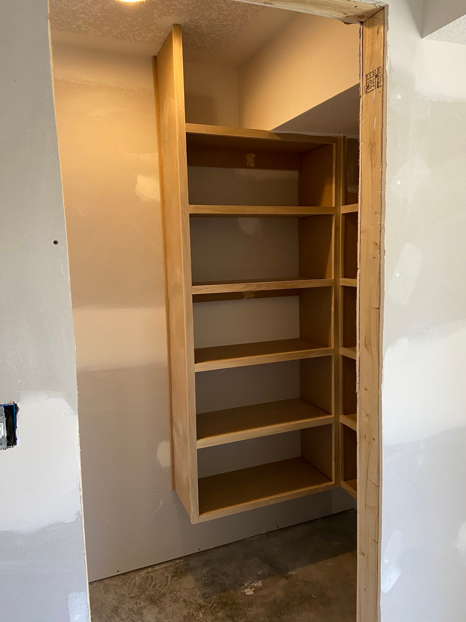 Wooden built-in shelving unit in a closet